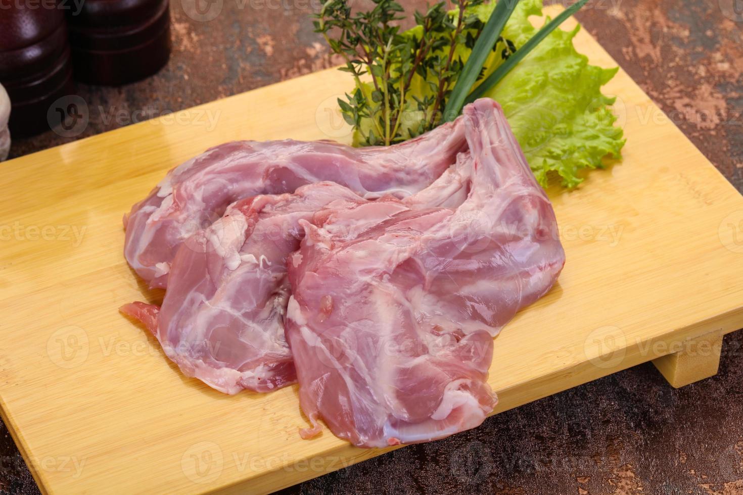 Raw rabbit legs photo