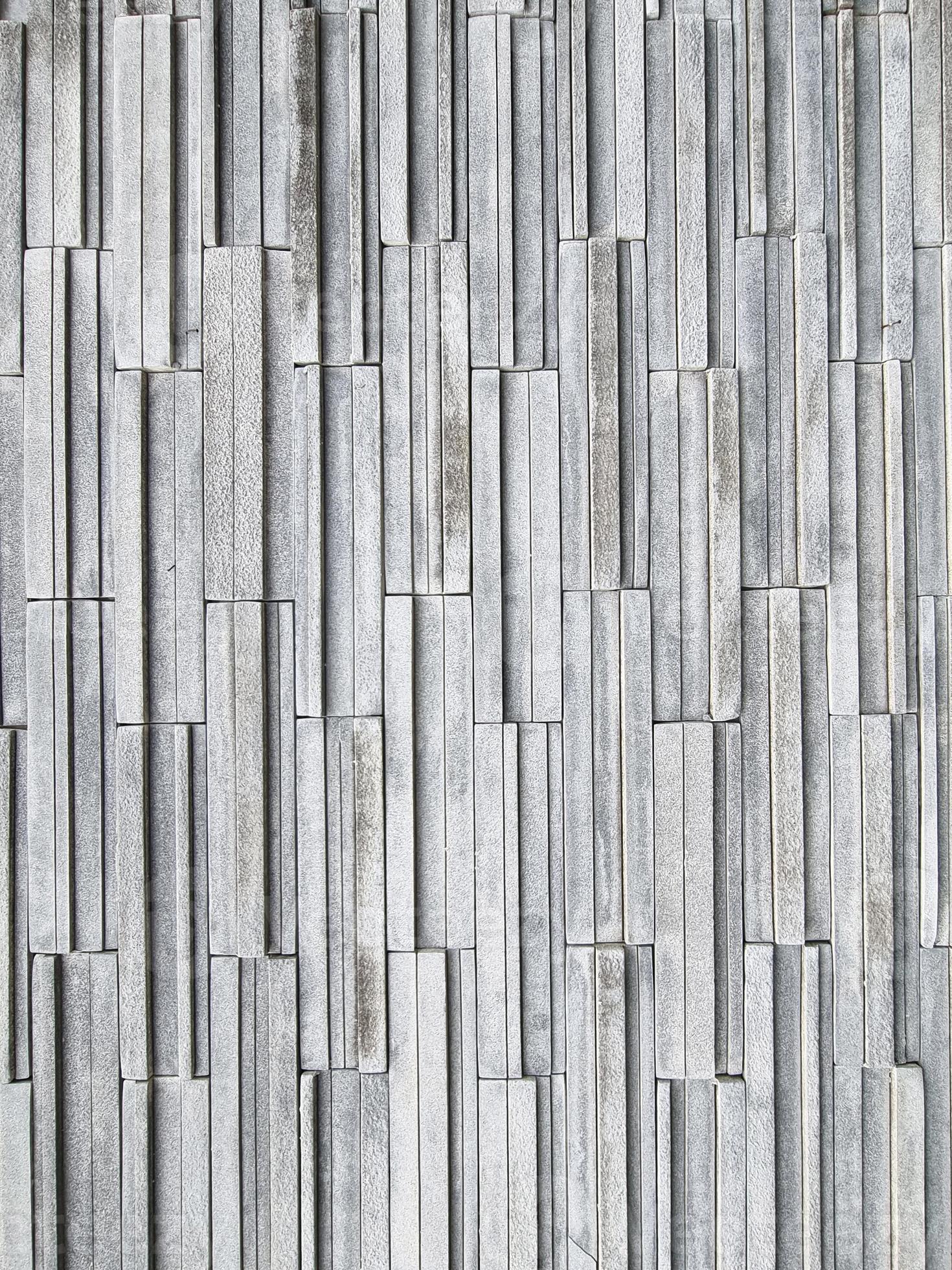 Luxury multi layer brick vertical line square shape gray color. strong brickwork wall outdoor
