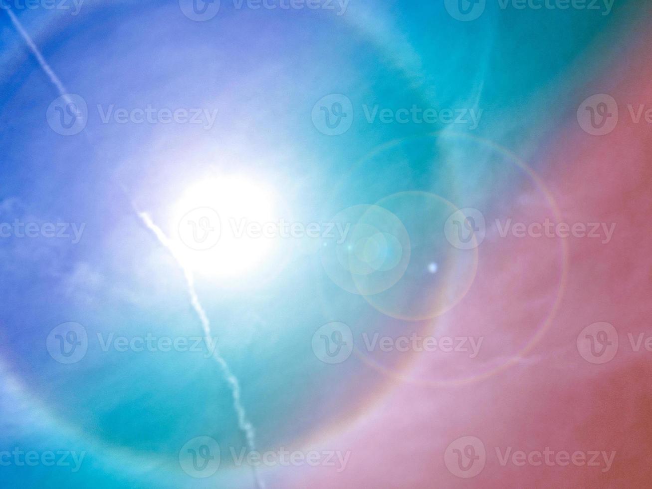 beauty sweet purple green  colorful with fluffy clouds on sky . sun halo circle rainbow ring around sunny. multi color rainbow image. abstract fantasy growing light photo
