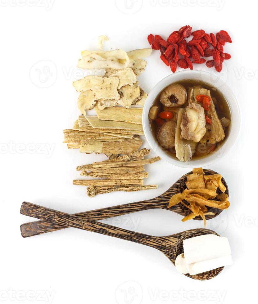 Top view of clear soup with chinese herbal medicine photo