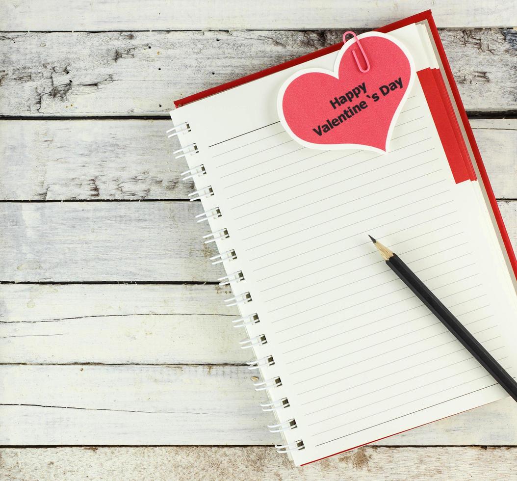 Notebook open with valentine day card photo