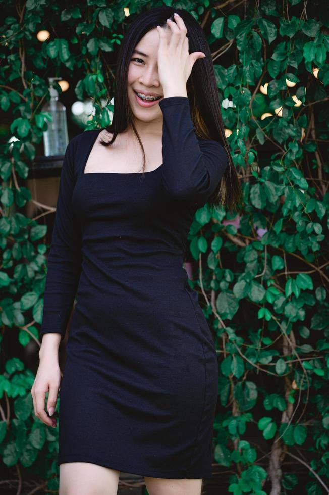 portrait of a beautiful woman in a black dress photo