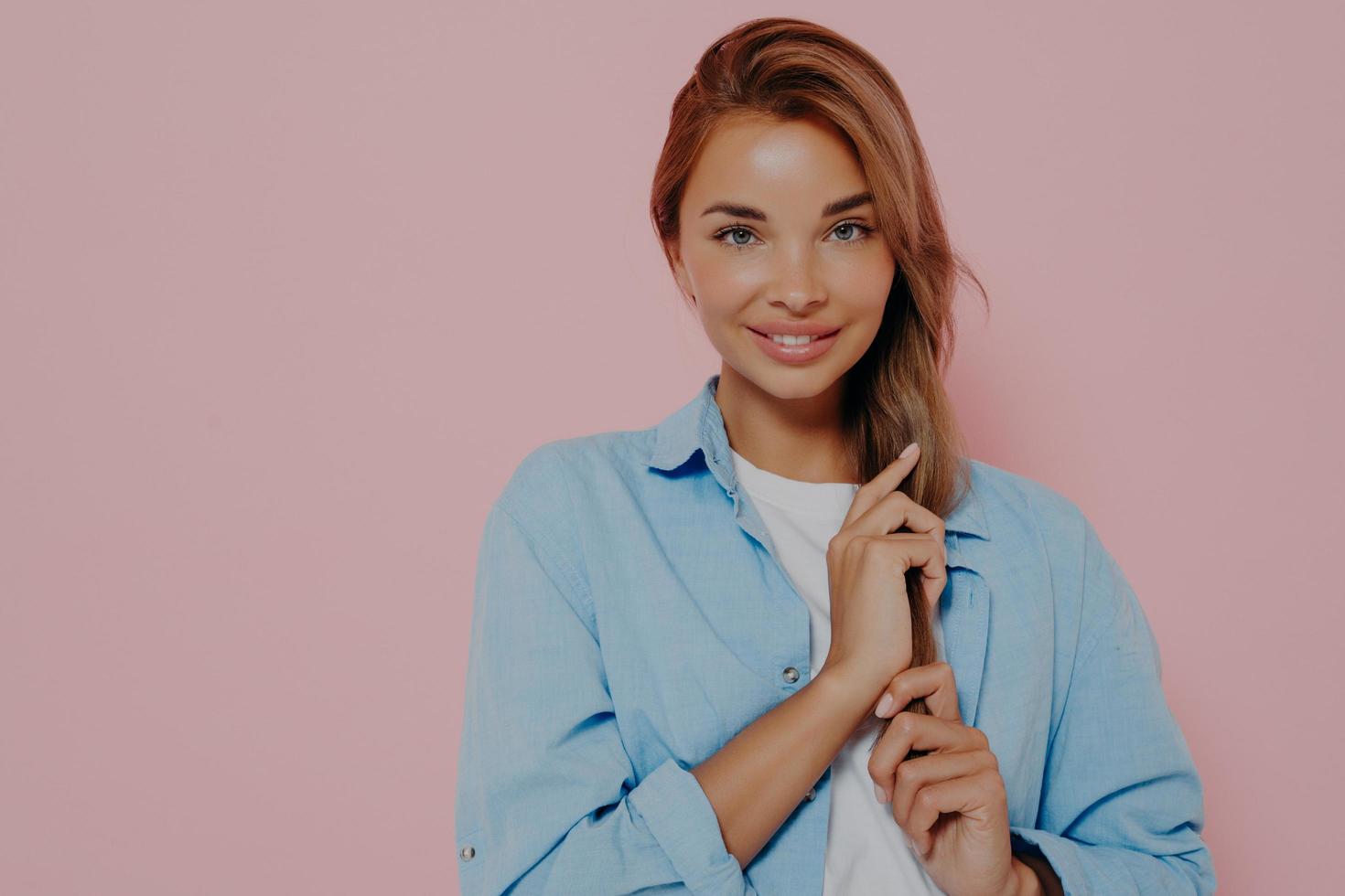 Isolated shot of attractive european student female with long straight hair photo