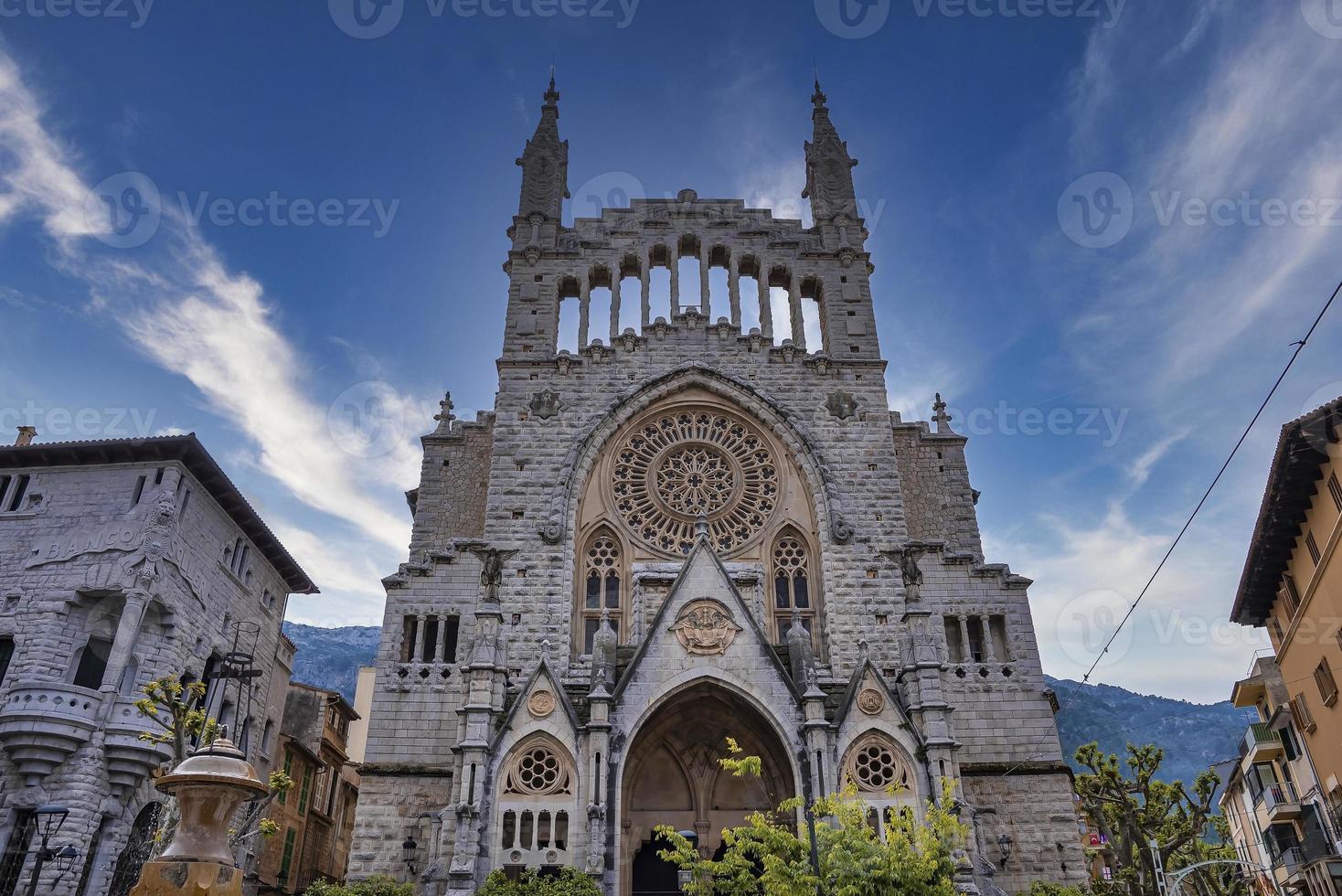 Low angle view of gothic Church of Sant Bartomeu de Soller against sky in town photo