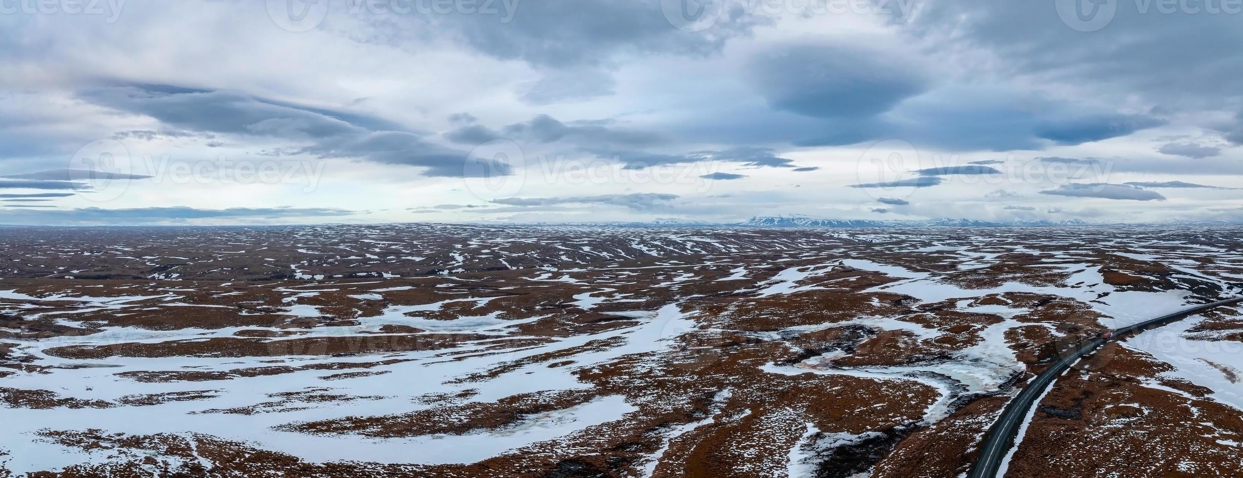 Aerial video of an empty lava fields and huge volcanic mountain in Iceland photo