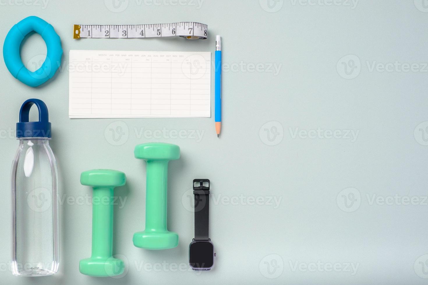 top view exercise stuff on green purple table for healty lifestyle photo