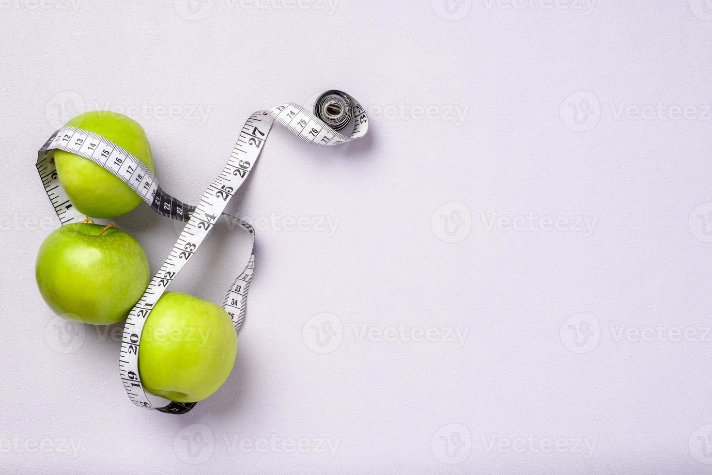 top view group of green apple with tape measure on pastel purple table photo