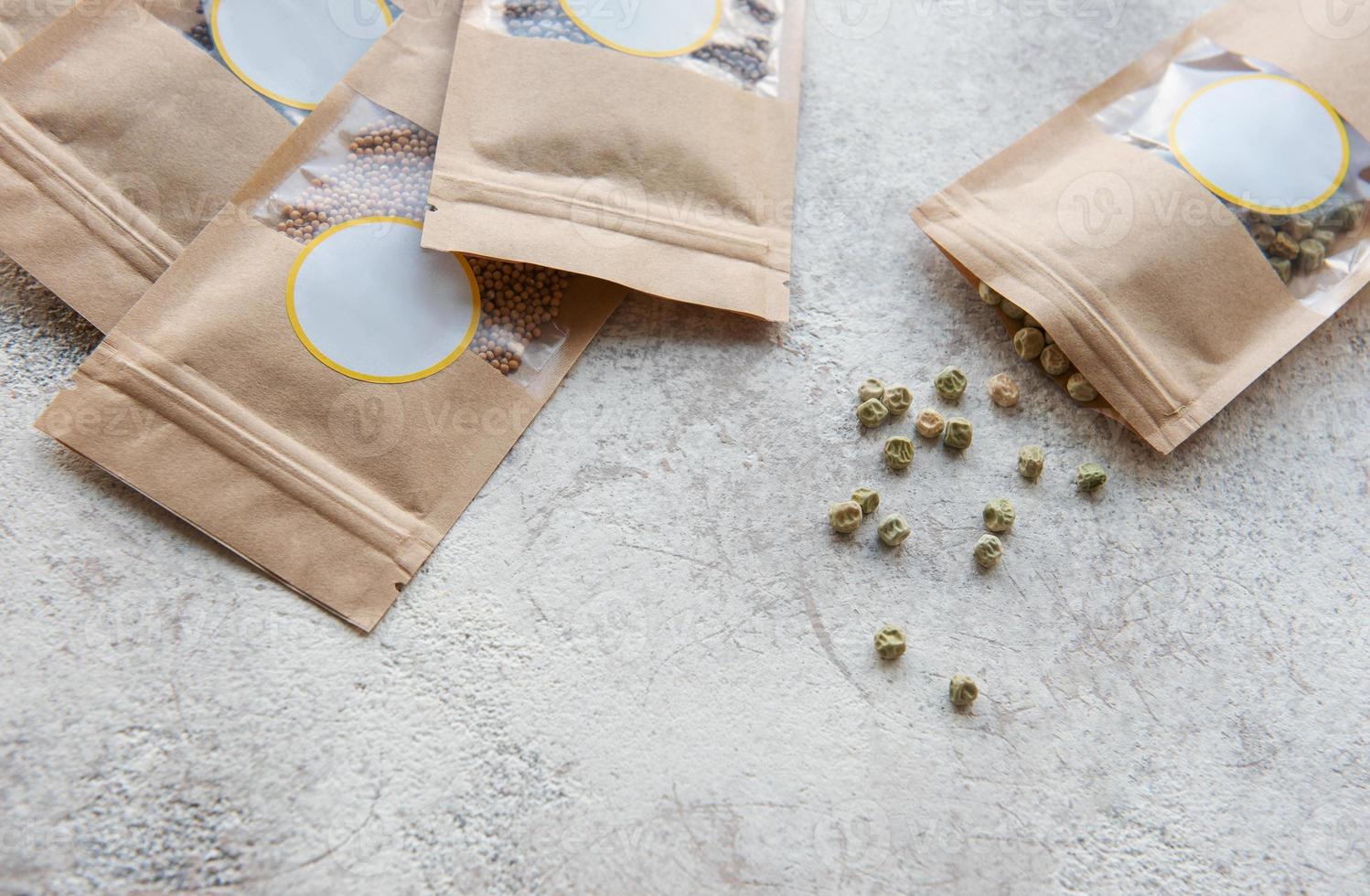 Microgreen seeds in paper bags and equipment for sowing microgreens. photo