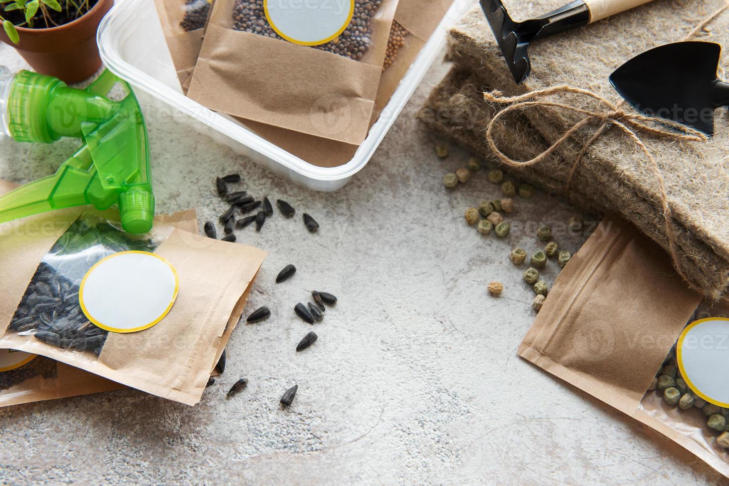 Microgreen seeds in paper bags and equipment for sowing microgreens. photo