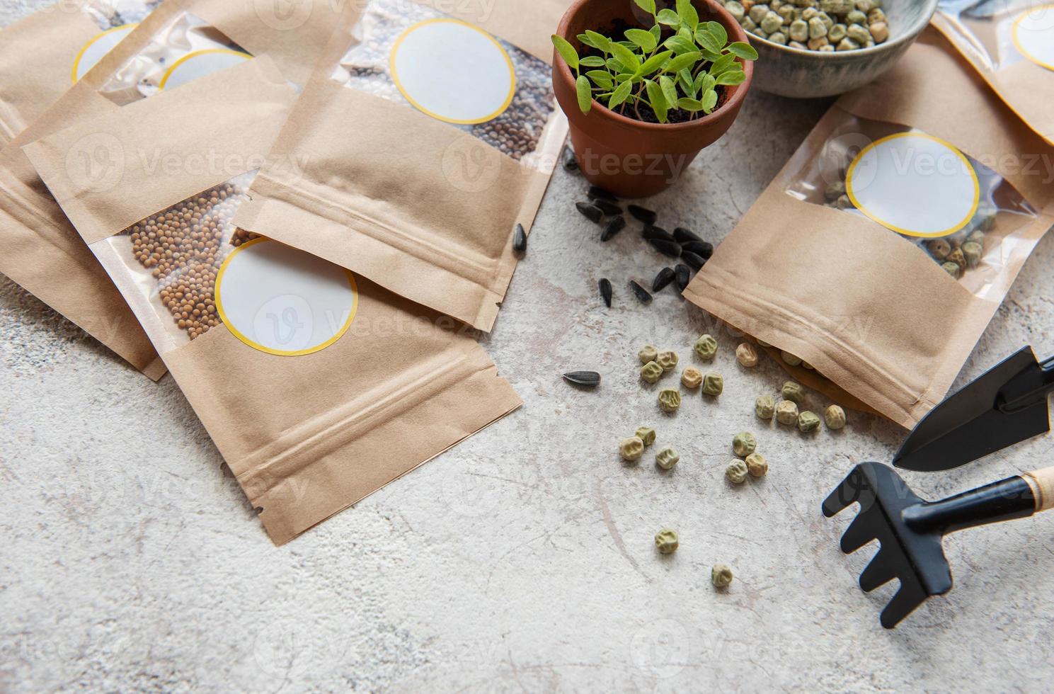 Microgreen seeds in paper bags and equipment for sowing microgreens. photo