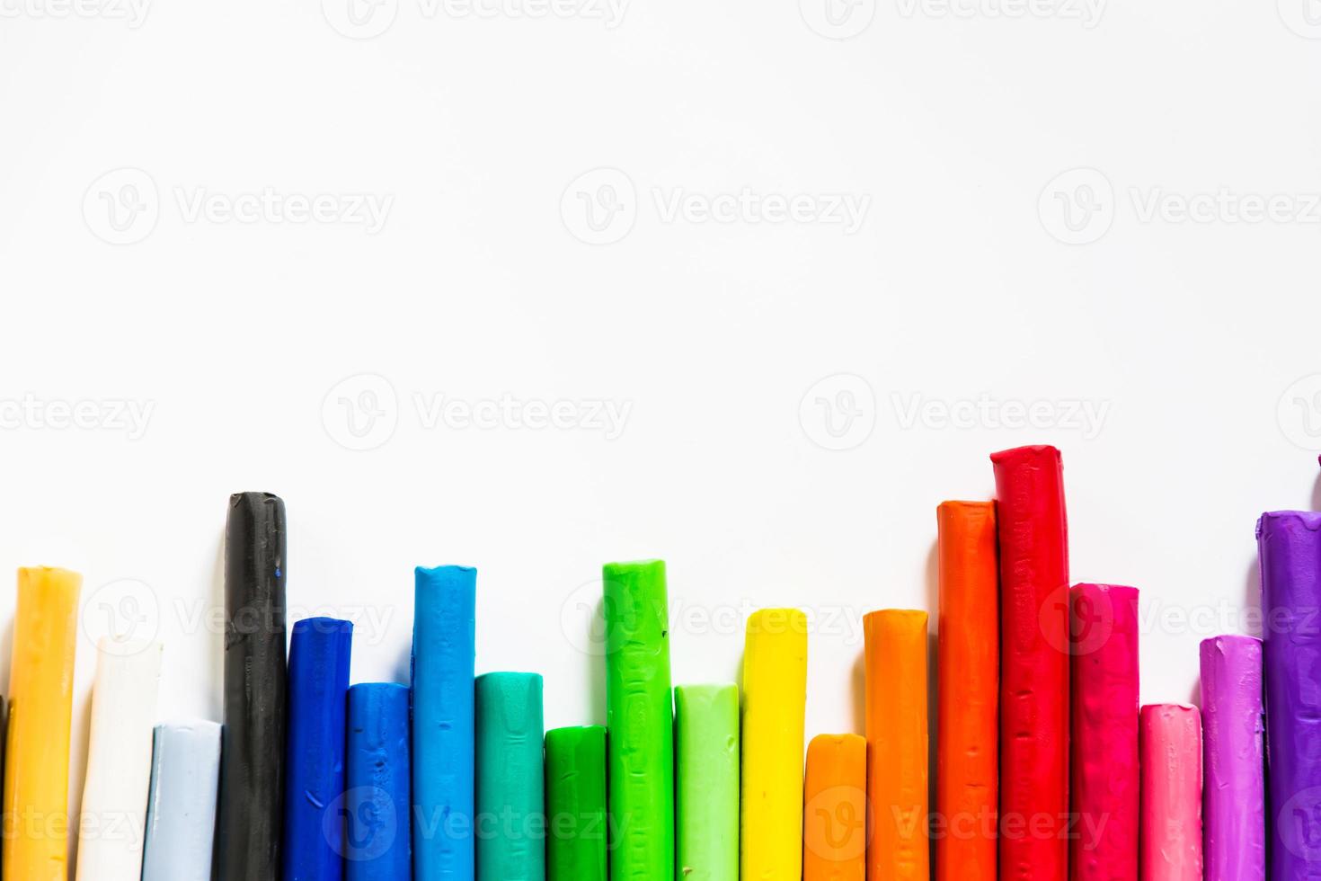 colorful plasticine sticks  clay on Isolated  background photo