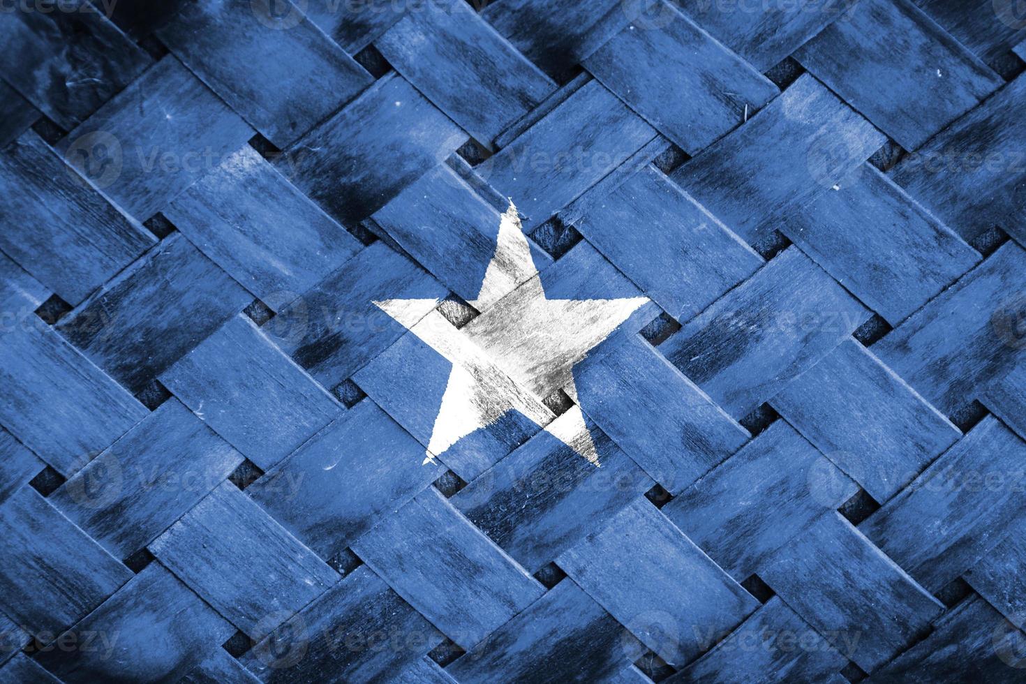 somalia flag screen on wicker wood background photo