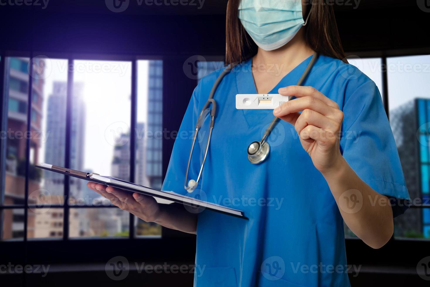COVID 19 virus disease diagnostic,doctor holding Coronavirus test cassette,rapid strep  kit,quick antigen detection testing photo