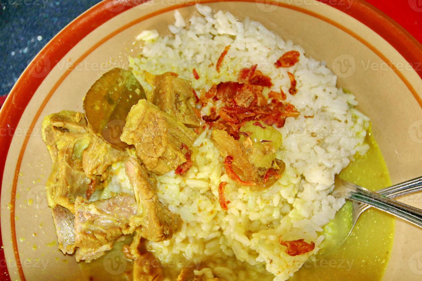 Goat curry with rice in plate photo