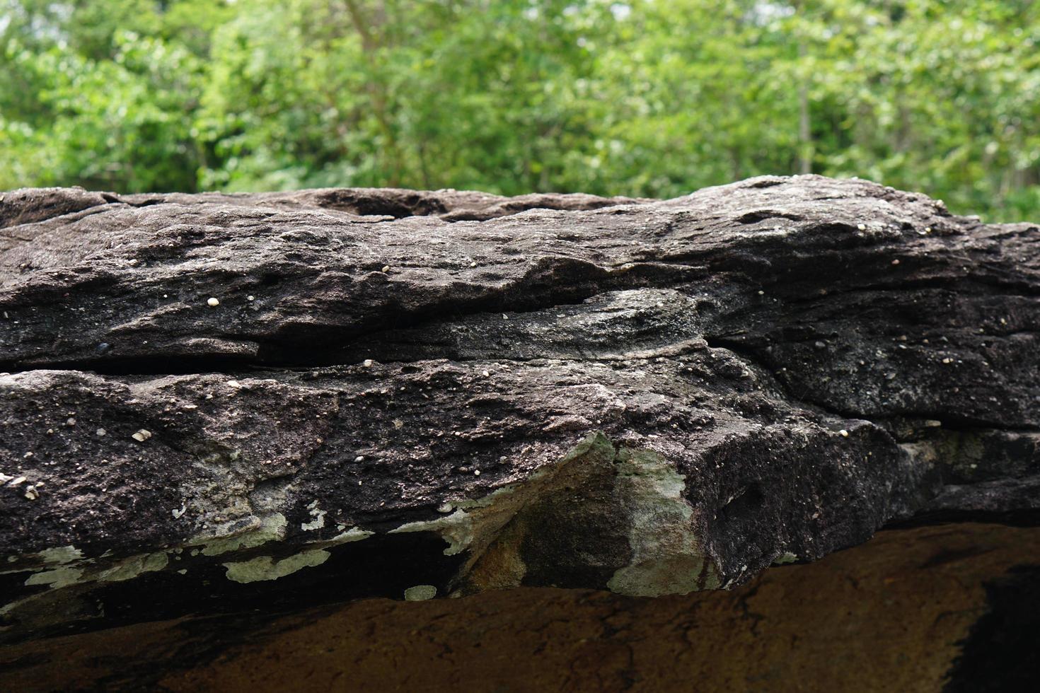 large rock that was eroded by water and wind to form a beautiful pattern. photo