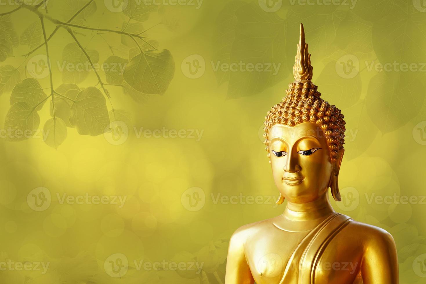 Makha Asanaha Visakha Bucha Day Golden Buddha image. Background of Bodhi leaves with shining light. Soft image and smooth focus style photo