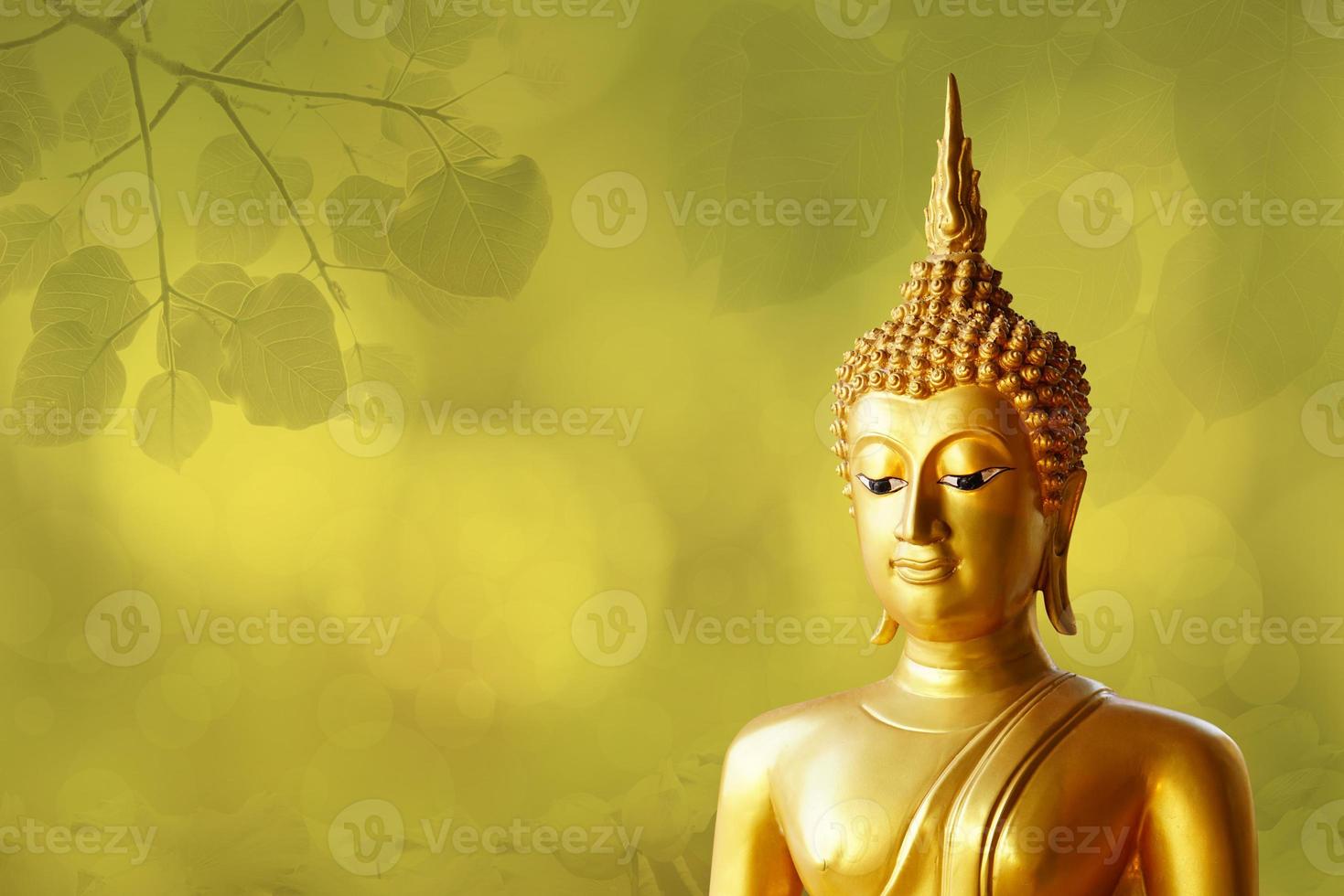 Makha Asanaha Visakha Bucha Day Golden Buddha image. Background of Bodhi leaves with shining light. Soft image and smooth focus style photo