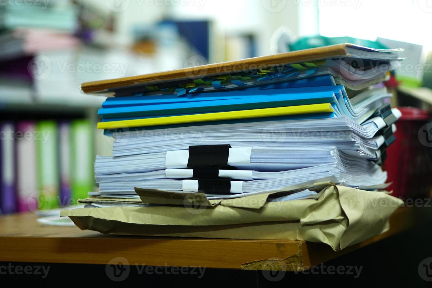 stack of papers on the desk photo