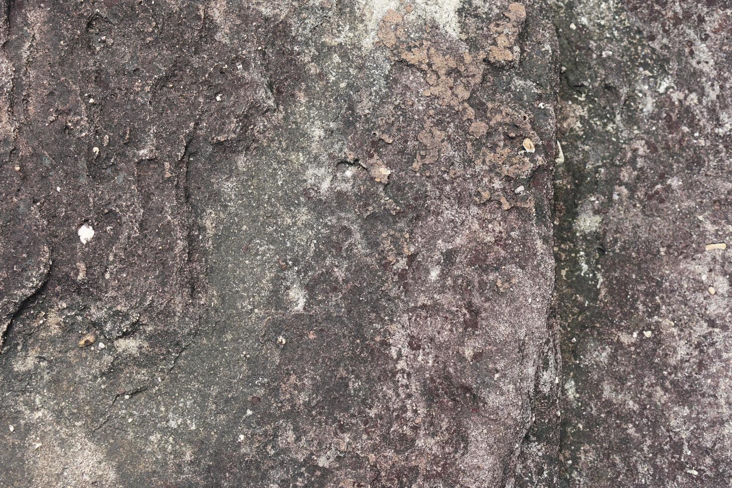 stone background was eroded by the wind creating a beautiful pattern. marble background with text photo