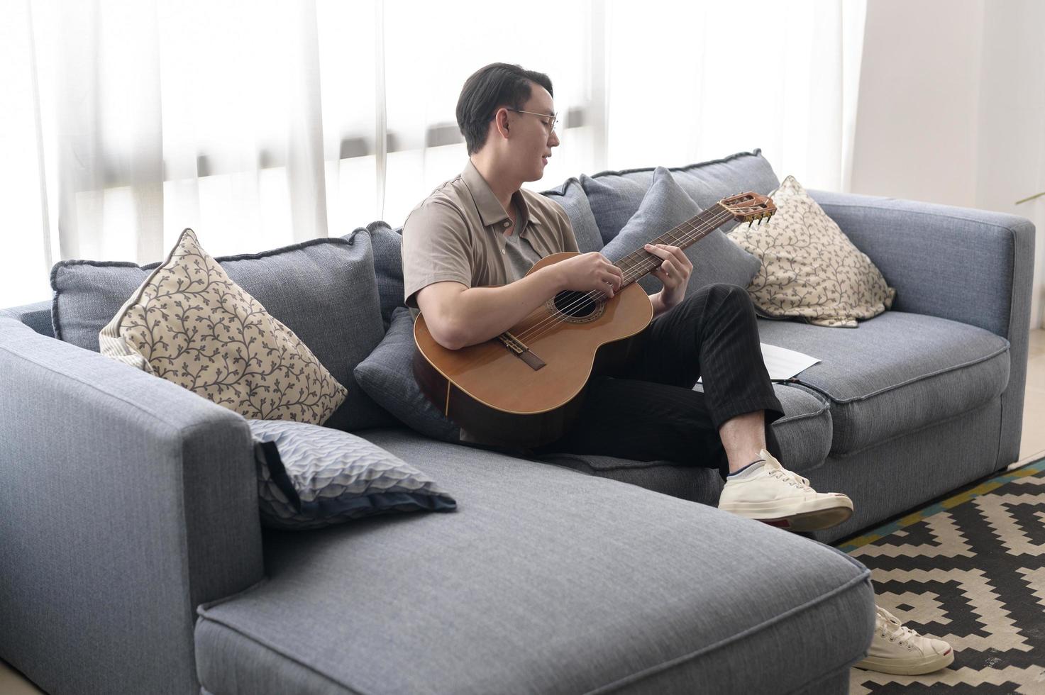 A musician is writing song in home Studio photo