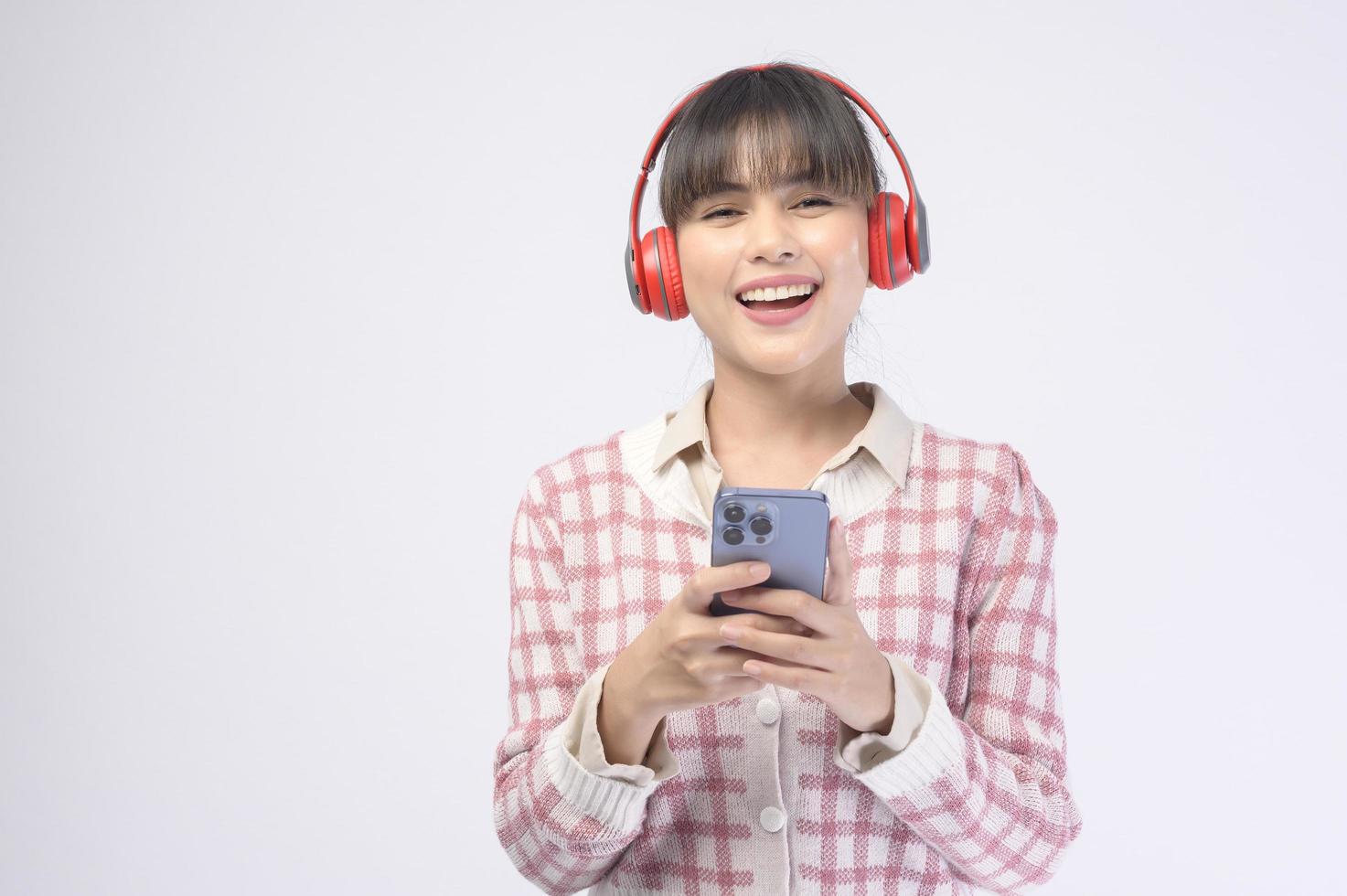 Young beautiful woman wearing headset on white background photo