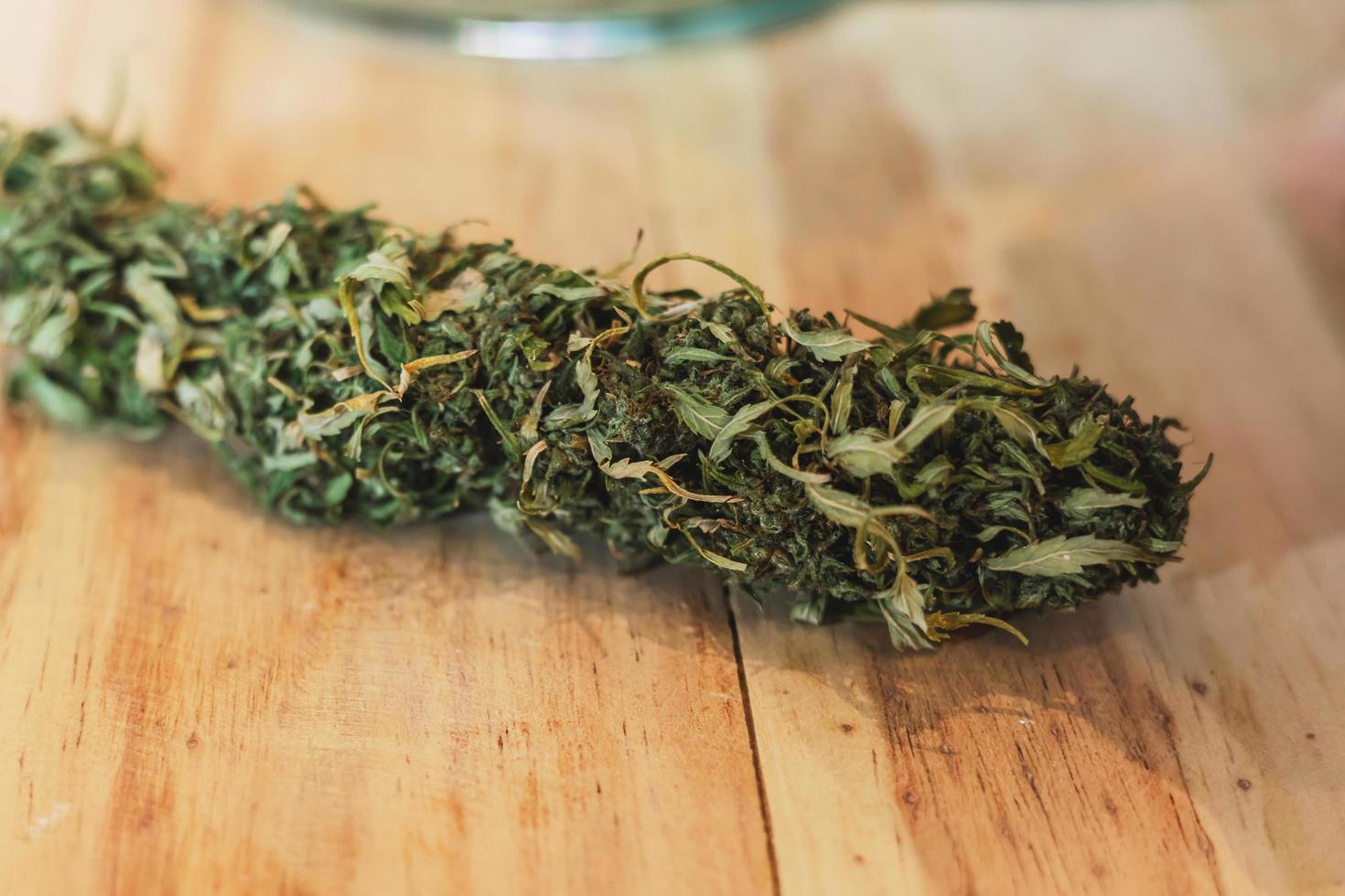 close up cannabis dry on table background photo