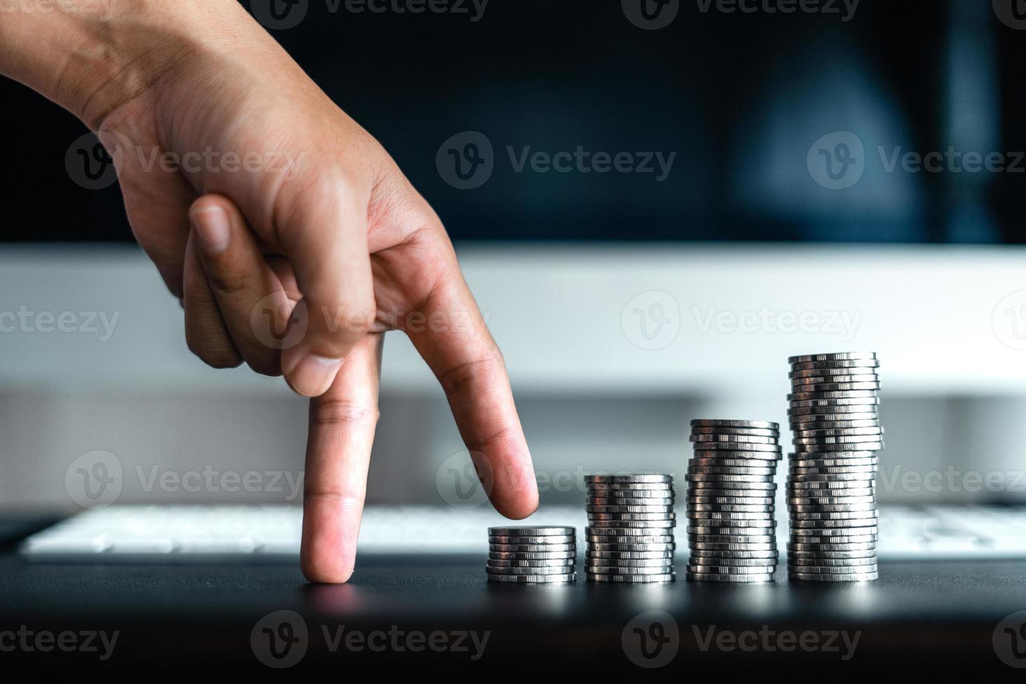 money growth,silver coins stacked up photo