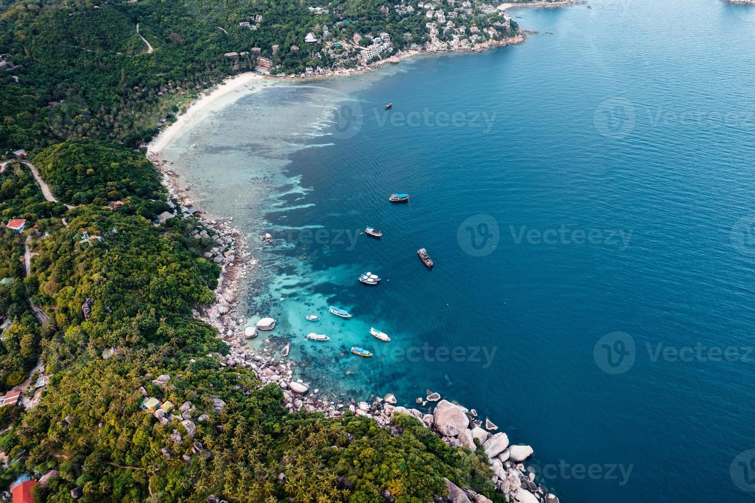 Bay and boats form above in island photo