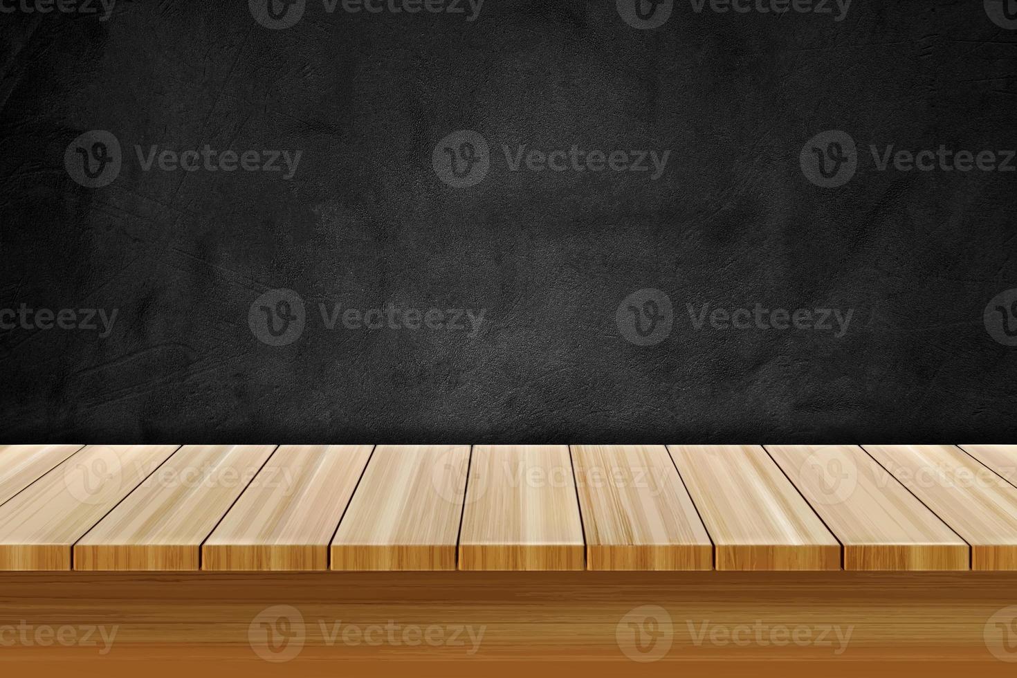 Empty wooden table over black textured chalkboard for product display photo