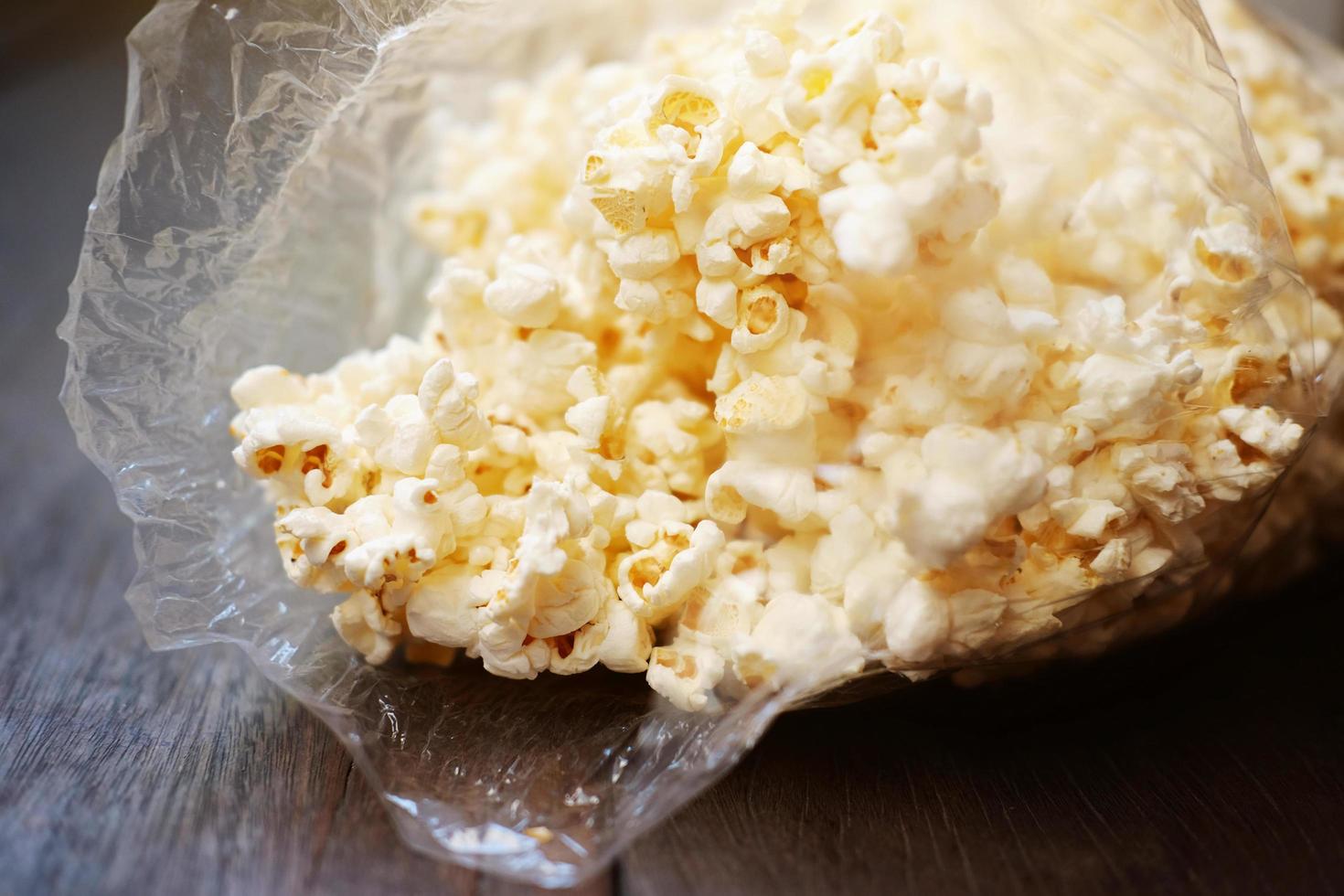 Delicious sweet Popcorn in plastic bags. photo