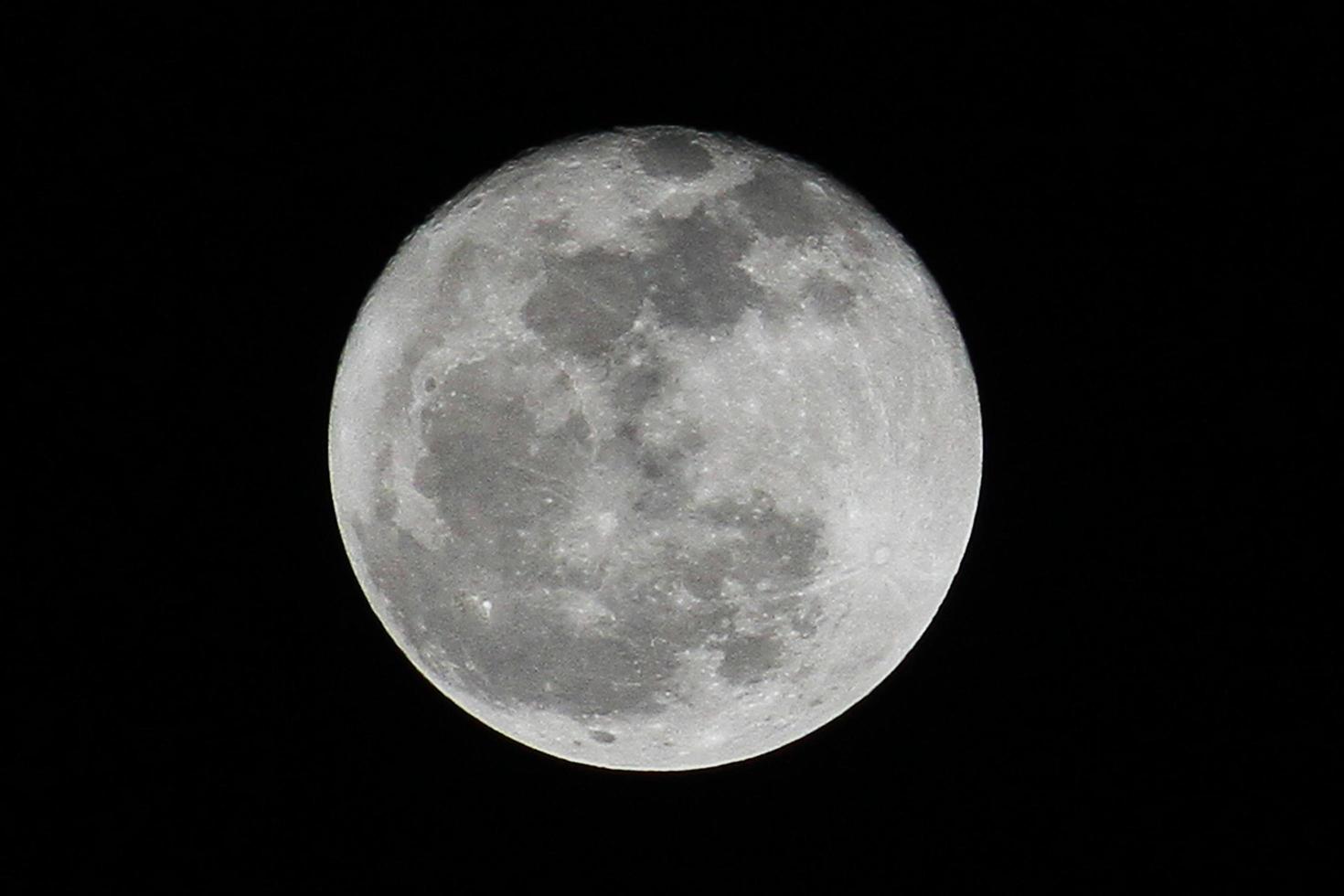 Power Light of Full super moon in dark black night and Show texture space of Lunar Surface. photo