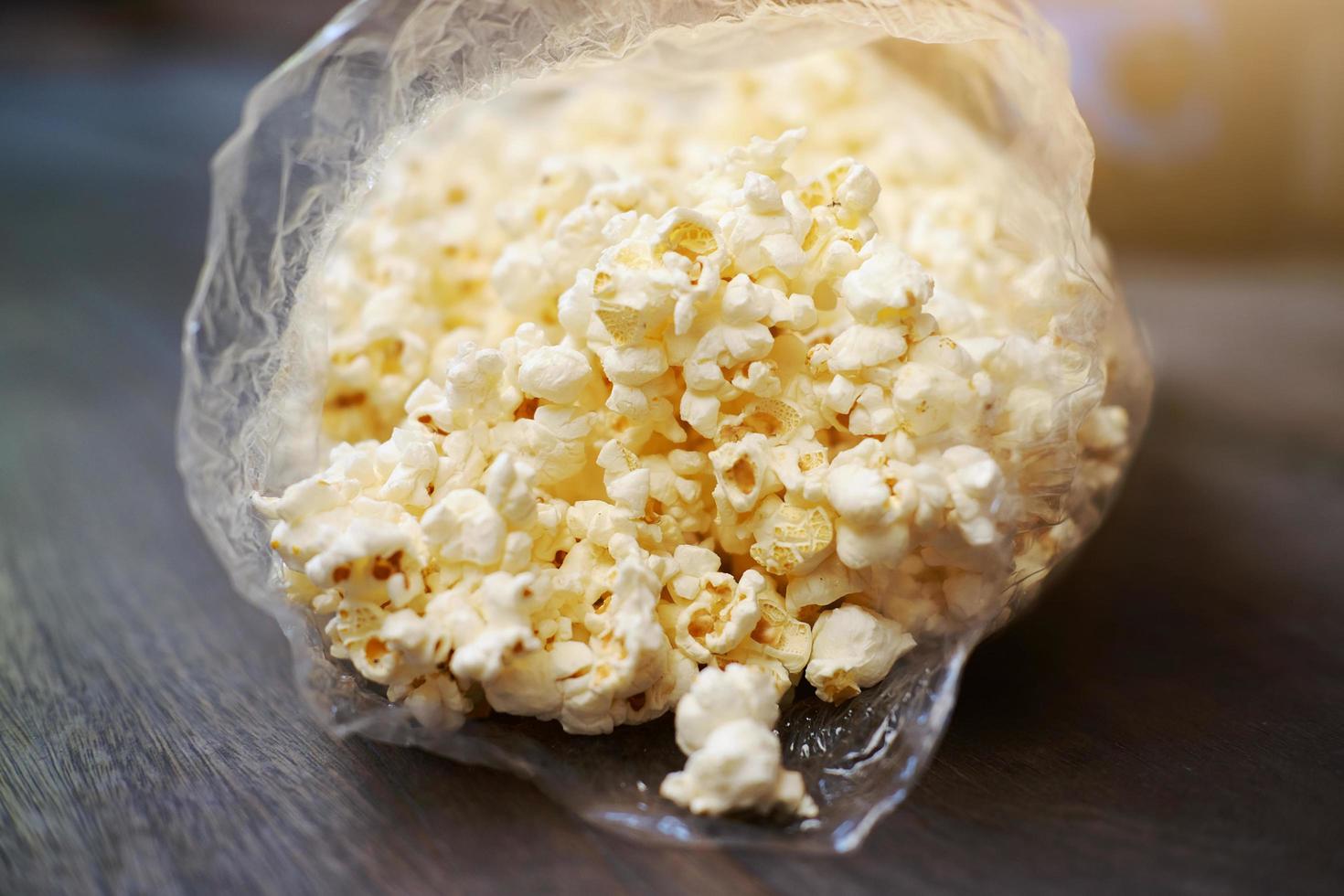 Delicious sweet Popcorn in plastic bags. photo