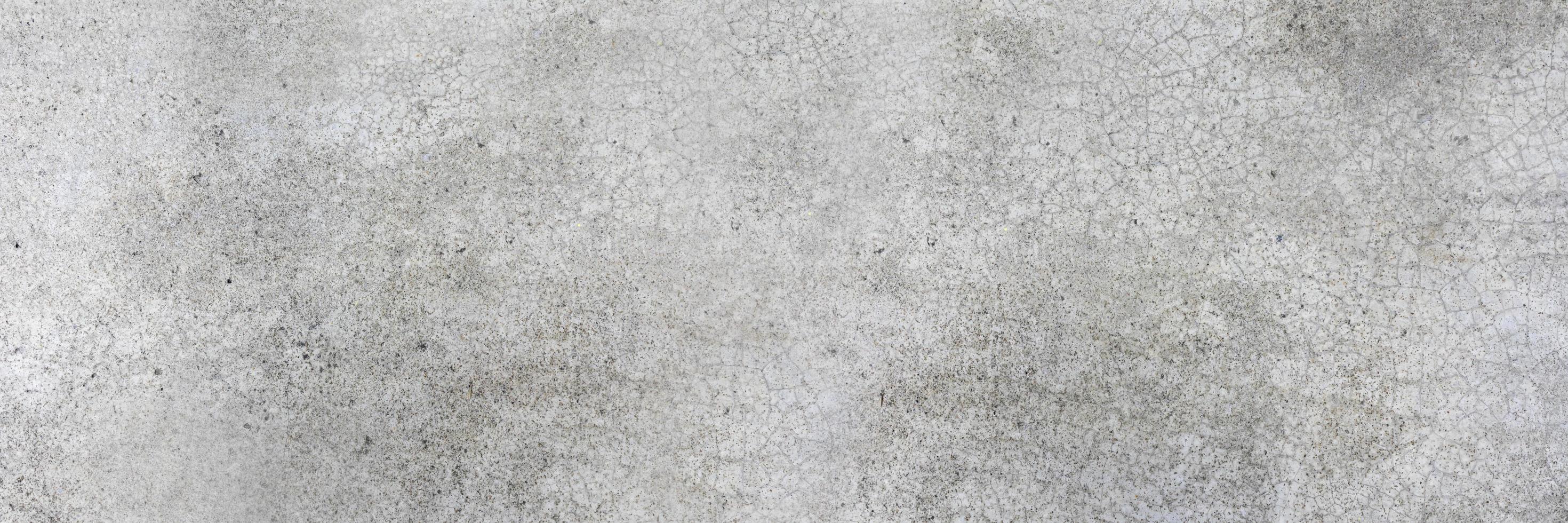 Concrete wall background with small cracks of the wall,decorative concrete wall photo