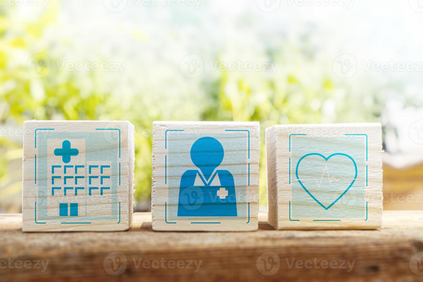 Access to the hospital, see a doctor for the right treatment.,wooden box with hospital, doctor and treatment icons photo