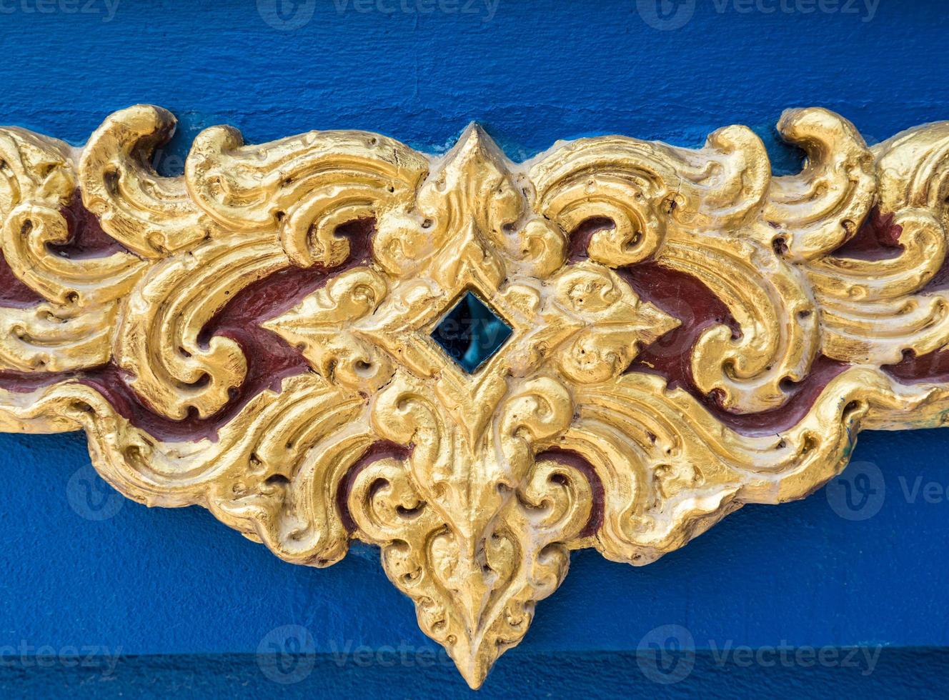 Traditional Thai pattern of the golden stucco. photo