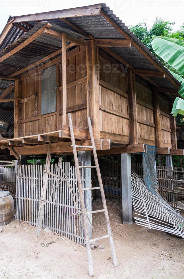 Old wooden barn withe the bamboo ladder. photo