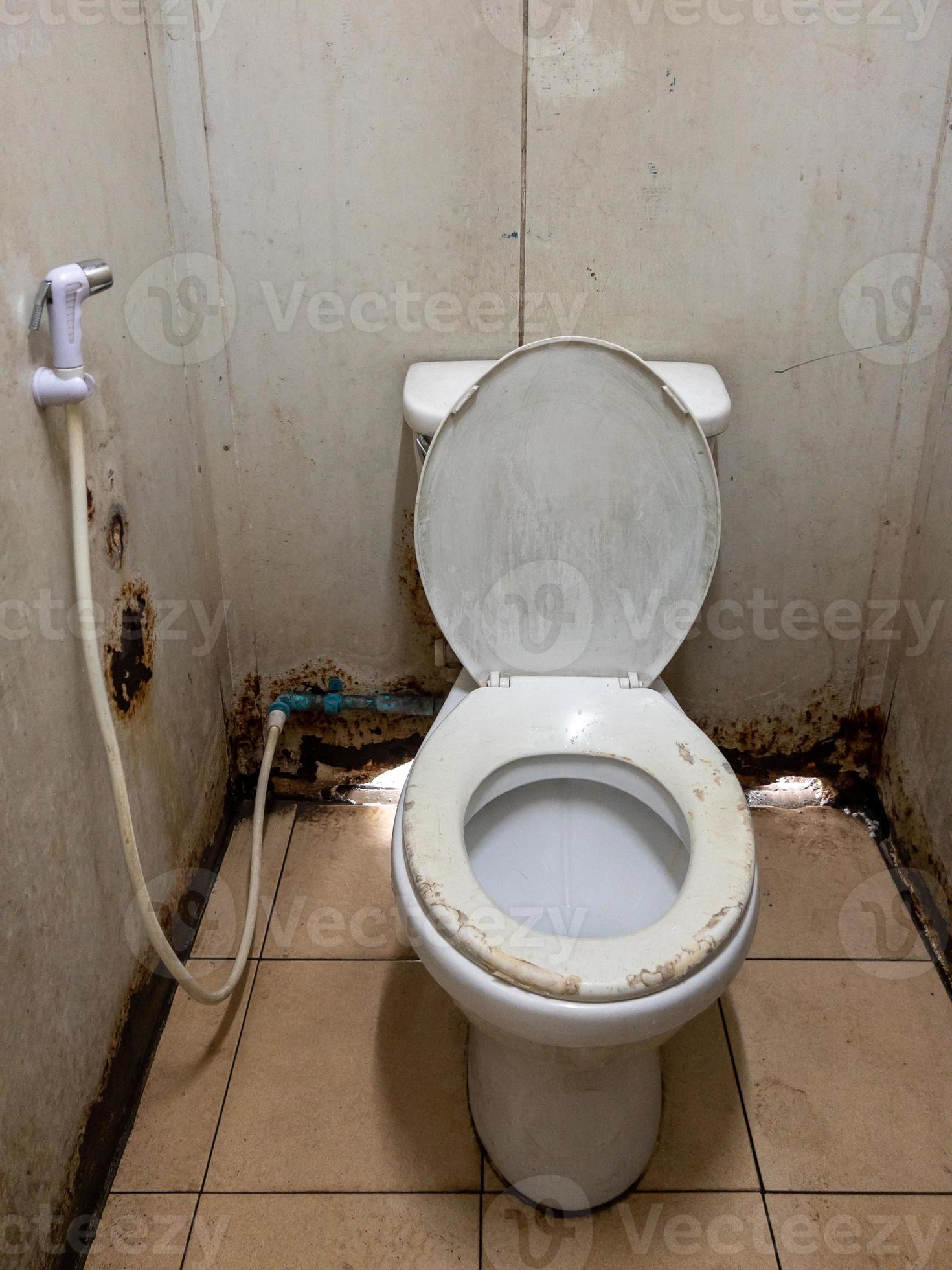 The dirty lavatory in the temporary public toilet of the urban station