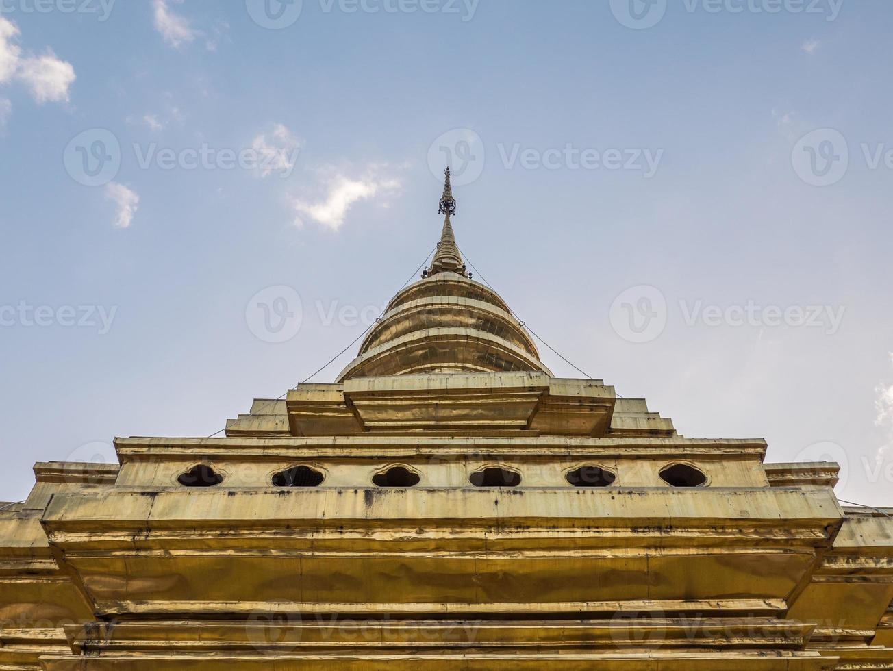 Large golden pagoda in the traditional northern thai style. photo