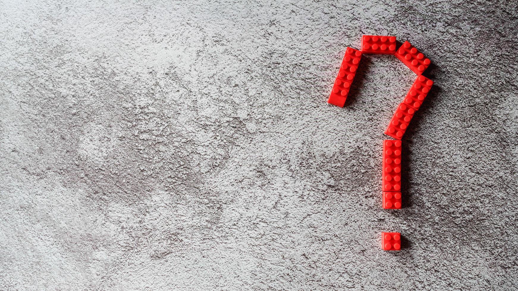 Red question mark  design from toy puzzle photo