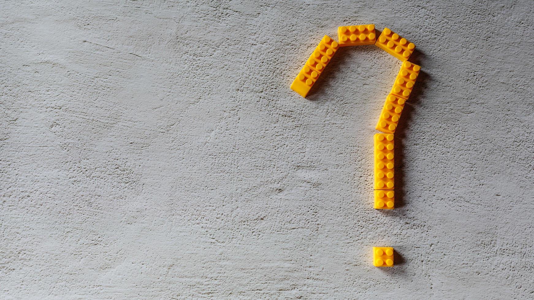 yellow question mark  design from toy puzzle photo