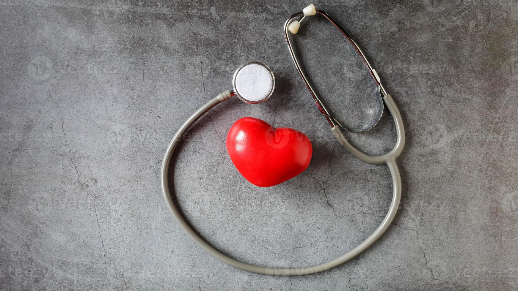 Heart with stethoscope heart examination concept photo