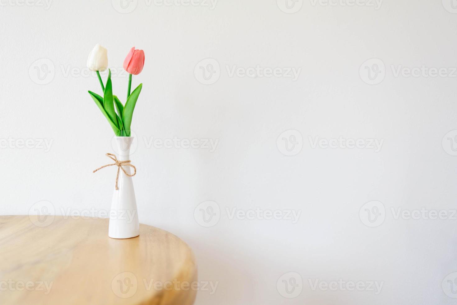 Tulips flower in a vase on a white background photo