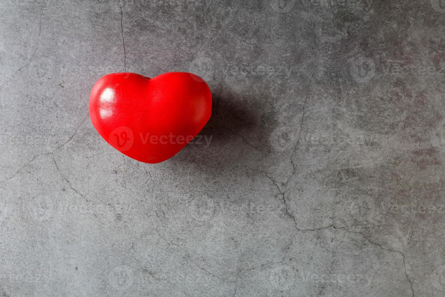 Red heart on black background photo