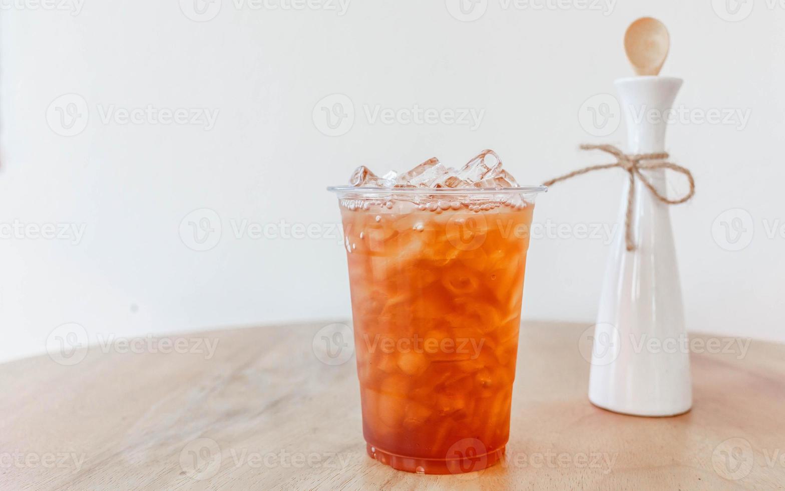 Ice peach tea  on wooden table photo