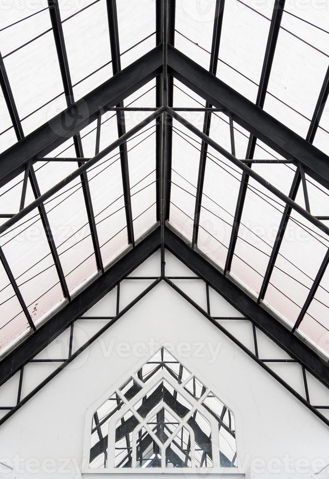 Triangle roof with the transparent tile on the pathway. photo