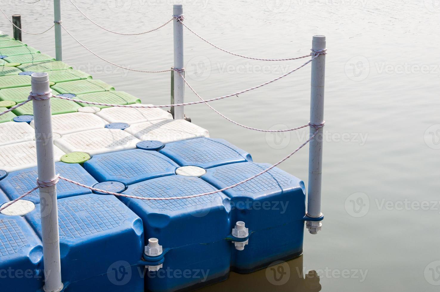 Plastic pontoon with the rope fence. photo