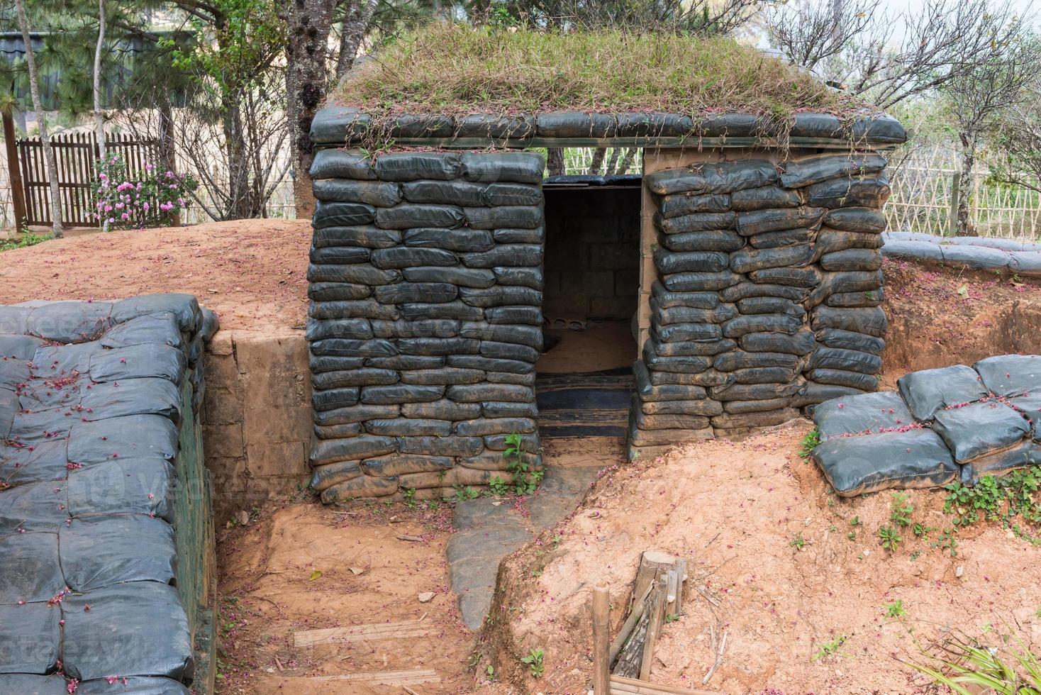 Cement shelter with sandbag photo