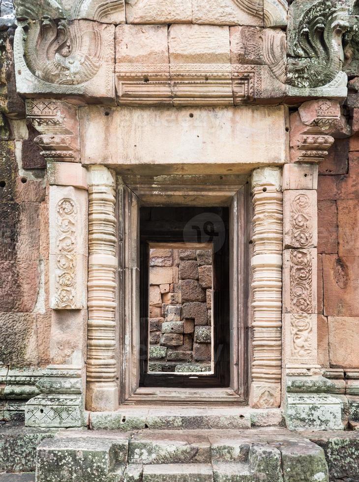 Sandstone door with the dragon sculpture. photo
