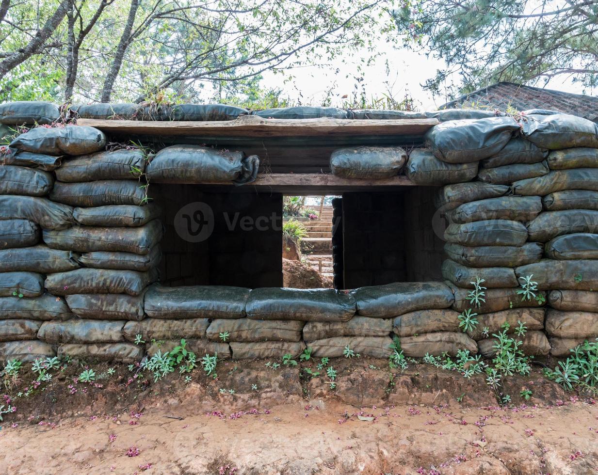 Cement shelter with sandbag. photo