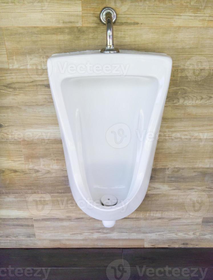 Clean ceramic urinal. photo